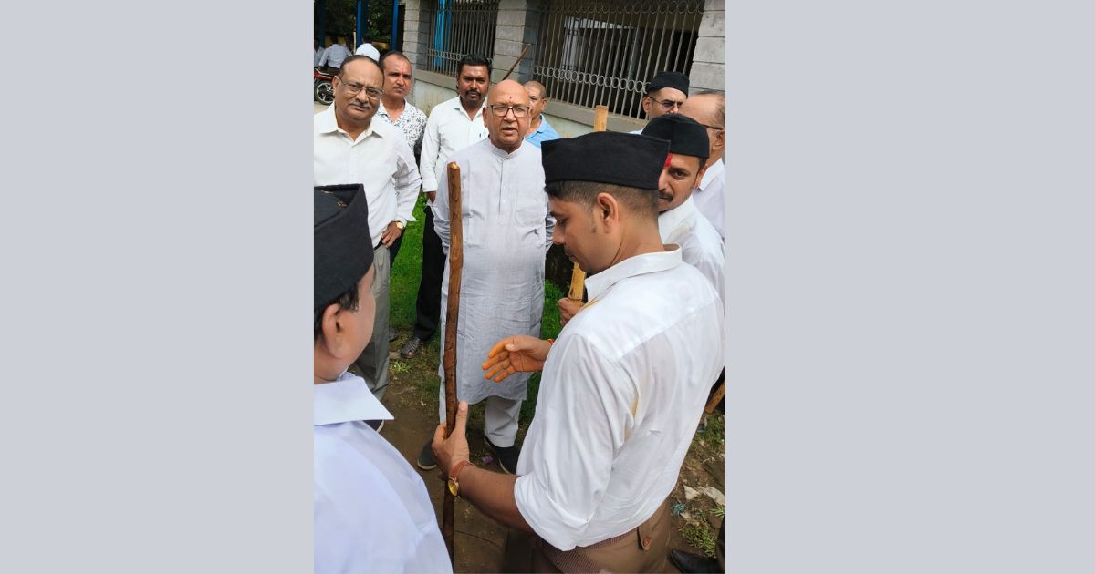RSS volunteers take out a march on the centenary year in Jamshedpur, Saryu Rai joins in