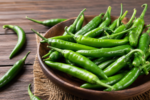 Green Chili Side Effects: एक दिन में कितनी हरी मिर्च खाना सही? ज्यादा सेवन से हो सकते हैं ये नुकसान
